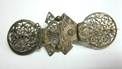 Brooch of pocket watch balance-cocks